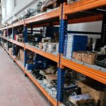 Long rows of industrial shelves stacked with various products in a Gaziantep warehouse.